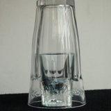 Coins And Rings in Glass Table - Remote Control -- Silk & Cane Magic