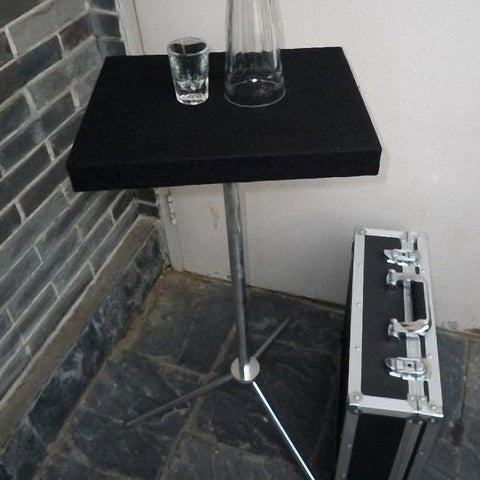 Coins And Rings in Glass Table - Remote Control -- Silk & Cane Magic